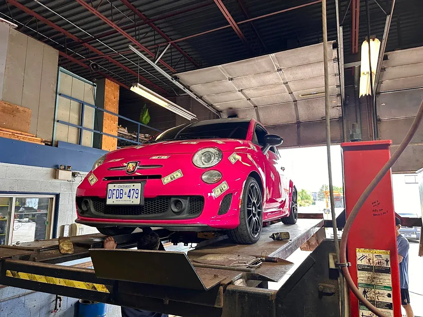 Passenger vehicle on the lift for repair at D&A Mechanics